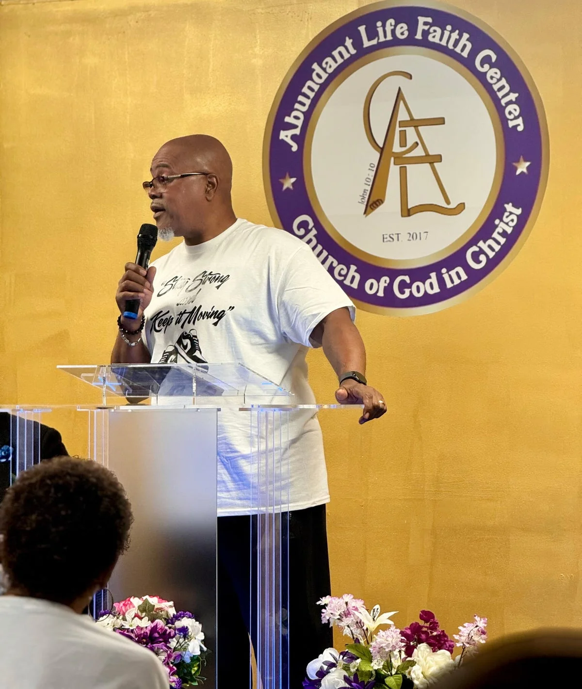 Teaching from the pulpit at Abundant Life Faith Center