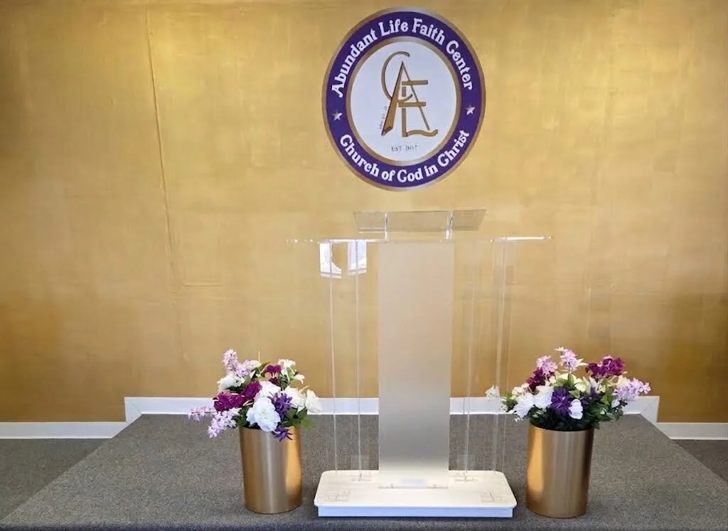 The pulpit and church emblem in the Abundant Life sanctuary